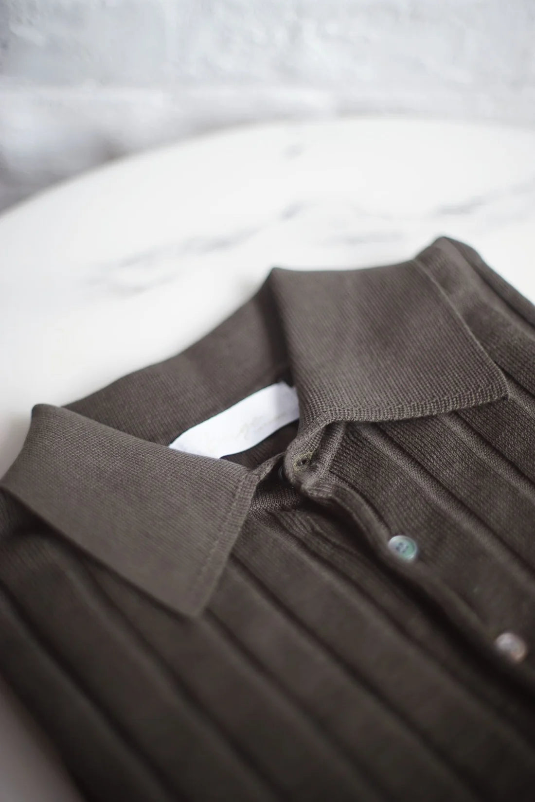 STRIPED KNITTED POLO SHIRT